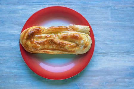 Balkan cuisine. Burek ( byrek, borek, bourekas, boreg ) is a baked filled pastries, popular national dish. Flat lay, copy spaceの写真素材