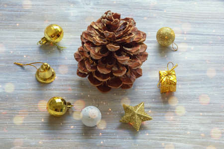 Pine cone and Christmas balls on rustic table. Bokeh. Christmas concepts. Copy spaceの写真素材