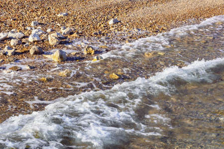 Seaside on a calm sunny day. Pebble beach of the Adriatic Sea, Montenegroの写真素材