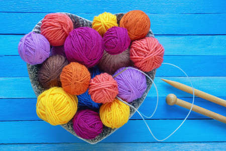 Hobbies and knitting concepts. Bright balls of wool and  knitting needles. Flat lay, copy spaceの写真素材