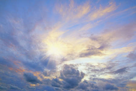 Clouds in sunset sky and light from sun.  Cirrocumulus cloudsの写真素材