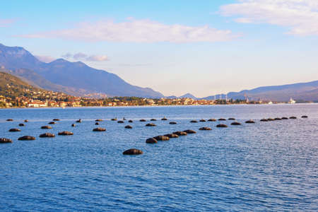 Mussel farm.  Growing mussels, rope culture. Beautiful Mediterranean landscape on sunny autumn day....