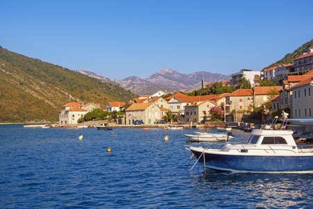 Beautiful autumn Mediterranean landscape. Seaside village on cost of bay.  Montenegro, Adriatic Sea. View of Kotor Bay and Lepetane village (Tivat)の写真素材
