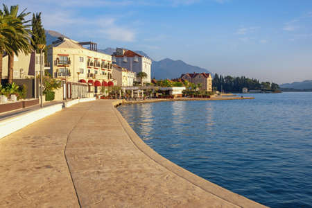 Sunny autumn day, beautiful Mediterranean landscape. Montenegro, Adriatic Sea. View of Bay of Kotor and embankment of  Tivat  cityの写真素材