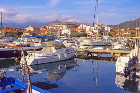 Marina for yachts and fishing boats. Sunny autumn day, beautiful Mediterranean landscape. Montenegro,  Bay of Kotor. View of Tivat city and marina Kalimanjの写真素材