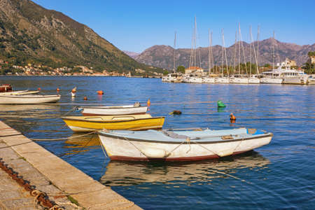 Sunny autumn Mediterranean landscape. Montenegro, Adriatic Sea.  View of  Kotor Bay near Old Town of Kotor. Fishing boats and yachtsの写真素材