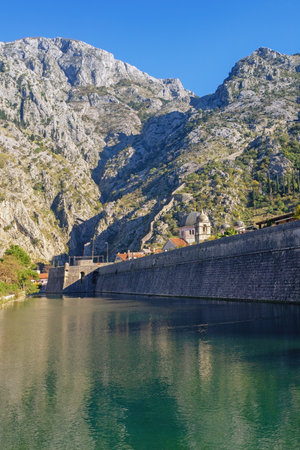 Montenegro, Old Town of Kotor. View of Skurda river and walls of ancient fortress on sunny autumn dayの写真素材