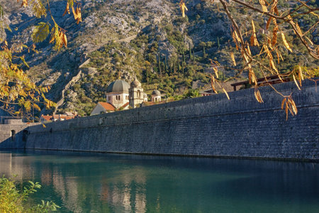 Montenegro, view of Old Town of Kotor on sunny autumn day. Mountains, Skurda river, domes of churches and walls of ancient fortressの写真素材