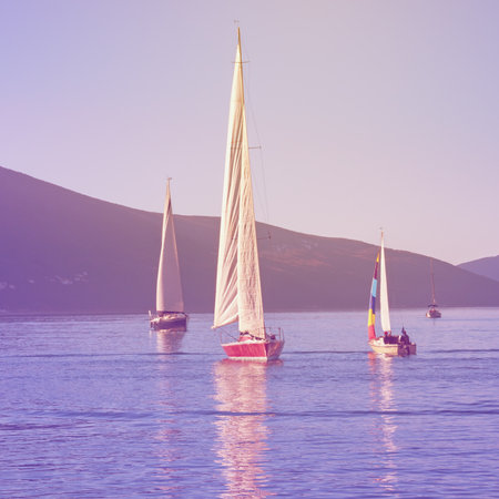 Sailboats on water. Montenegro, Adriatic Sea, Kotor Bay. Travel concept. Color tintingの写真素材
