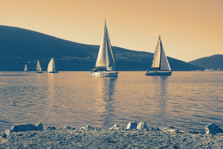 Beautiful Mediterranean landscape with sailing boats on water. Montenegro, Kotor Bay. Color tintingの写真素材