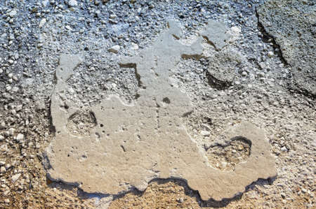 Random abstract images on the old asphalt road surfaceの写真素材