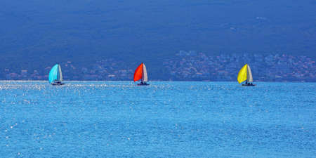 Colorful Laser sailboats sail along the Bay of Kotor. Montenegro, Adriatic Sea, Tivat. Travel concept. Backgroundの写真素材