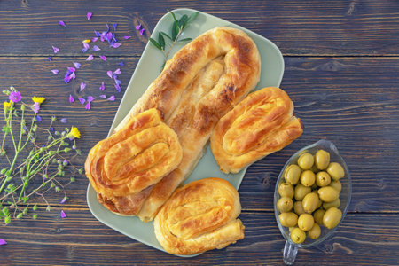 Balkan cuisine. Burek, filled pastry, popular national dish in Balkans. Rustic table, copy spaceの写真素材