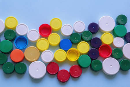 Colorful plastic bottle caps, flat lay, copy spaceの写真素材