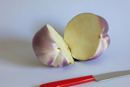 One eggplant on blue background. Copy spaceの写真素材