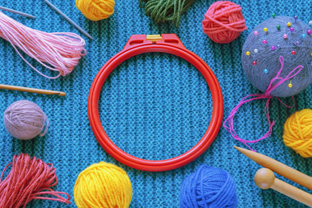 Hobby concept. Embroidery frame, colorful balls of wool, knitting needles,  accessories. Copy spaceの写真素材