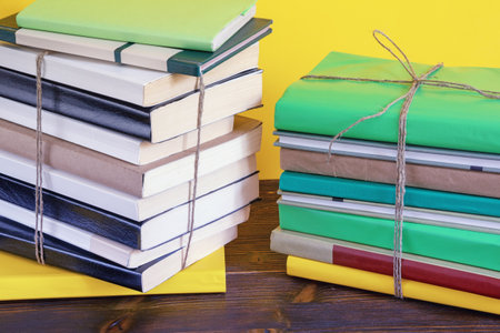 Stacks of different books tied with rope. Copy spaceの写真素材