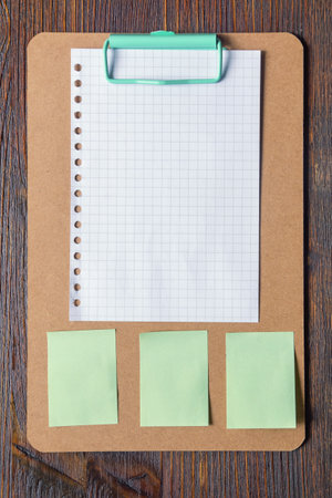 Clip board with blank paper and notesの写真素材