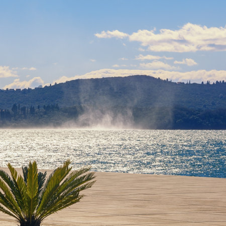 Winter wind over the bay on sunny day. Beautiful Mediterranean landscape. Montenegro, Adriatic Sea. View of Bay of Kotor, Tivat cityの写真素材