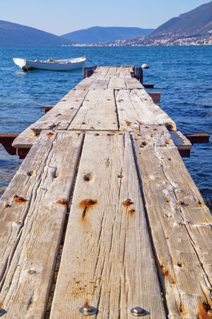 Old wooden pier on coast of Bay of Kotor, Tivat. Montenegroの写真素材