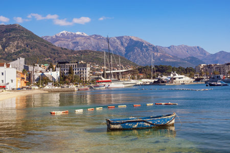 Beautiful Mediterranean landscape on sunny March day. Montenegro, Adriatic Sea. View of Bay of Kotor, snowcapped Lovcen mountain, Tivat cityの写真素材