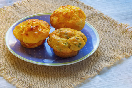 Balkan cuisine. Proja -  cornbread, prepared as muffins, on rustic tableの写真素材