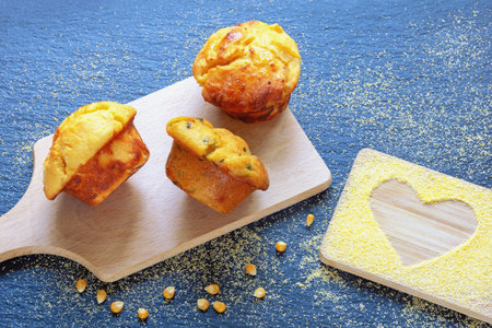 Balkan cuisine. Proja -  cornbread, prepared as muffins - on cutting boardの写真素材