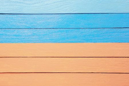 Texture of painted wooden boards, blue and light-orange backgroundの写真素材