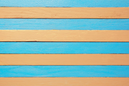 Wooden boards, blue and light-orange color stripes, backgroundの写真素材