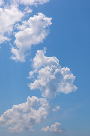 Cumulus clouds. Beautiful white clouds in blue skyの写真素材