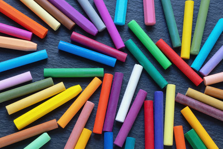 Colorful oil pastel crayons on black backgroundの写真素材