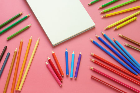 Sketchbook and bright colored pencils. Copy spaceの写真素材