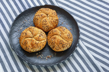 Sesame Kaiser Rolls (Emperor roll, kajzerica), round bread rolls. Copy spaceの写真素材