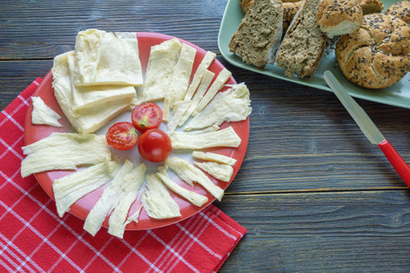 Balkan cuisine. Montenegro. Leafy cheese  - specific type of home-made cheese.  Dark rustic table, copy spaceの写真素材
