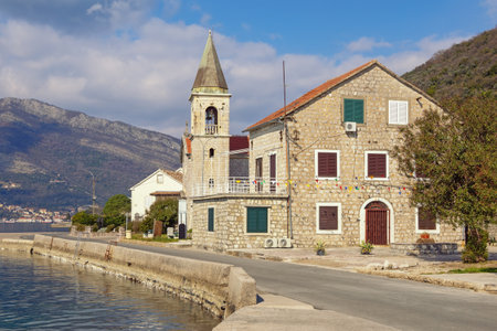 Beautiful autumn Mediterranean landscape. Montenegro, Adriatic Sea. View of Bay of Kotor and  Donja Lastva village, Tivat.  Catholic Church of Saint Rochの写真素材
