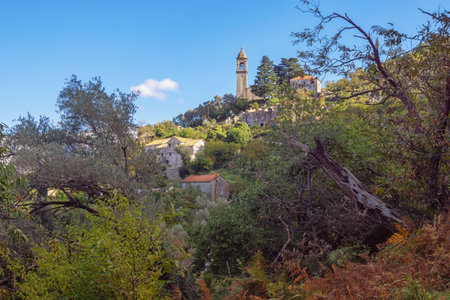 Beautiful autumn Mediterranean landscape on sunny November day. View of Gornji Stoliv village and church of Sv. Ilija (St. Elijah). Montenegro, Kotor municipalityの写真素材