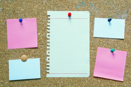Old cork board with different notes. Free space for text or images