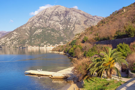 Beautiful Mediterranean landscape. Montenegro, Adriatic Sea. View of Bay of Kotor on sunny winter day. Perast town in distanceの写真素材