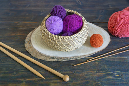 Hobby and knitting concept. Colorful balls of wool and knitting needlesの写真素材