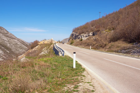 Balkan road trip. Sunny mountain landscape with road in Dinaric Alps. Bosnia and Herzegovina, Republika Srpskaの写真素材