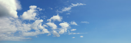 Blue sky with white clouds, background. Cumulus cloudsの写真素材