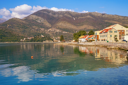 Mediterranean landscape. Montenegro, Tivat. View of the Bay of Kotor. Mountains, clouds and village ...