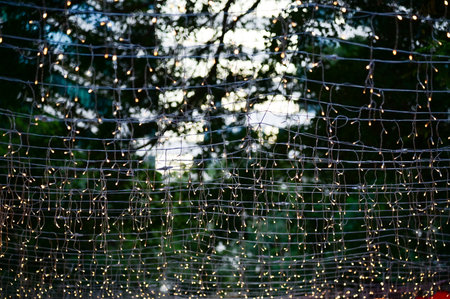 Close-up of the outdoor starry solar string lights. Festive decoration. For background use.の写真素材