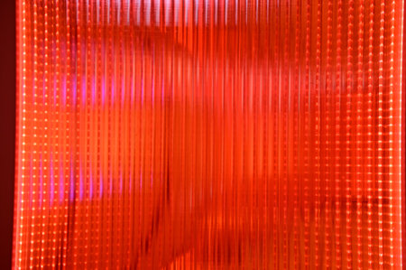 Close-up of the red semi transparent glass wall with the shape of traditional Chinese lantern. For background use.の写真素材