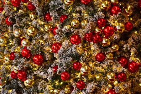 Close-up of the Christmas trees with colorful ornaments. Festive decoration. Full of ornaments....