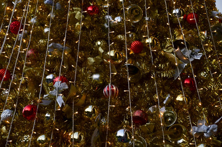 Close-up of the Christmas trees with colorful ornaments. Festive decoration. Full of ornaments....