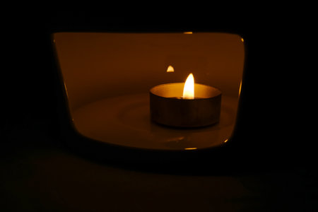 Close-up of the candle. Lighting concept. Abstract background.の写真素材