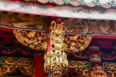 Close-up of the ornate decor on the Mengjia Longshan Temple in Taipei, Taiwan. Chinese folk religion landmark. Buddhist Temple. Religious and traditional Chinese art.の写真素材