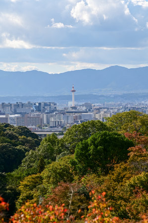 The view of Kyoto city skyline with blue sky and trees from Kiyomizu-dera temple in Kyoto, Japan. Major tourist attraction in Kansai region in Japan. Travel concept.の写真素材