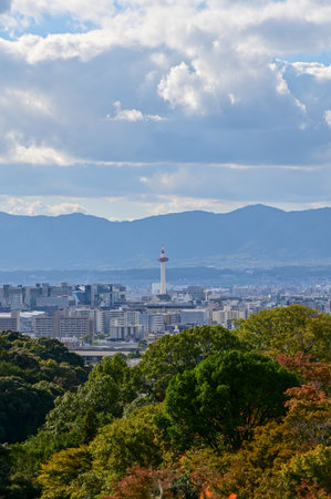 The view of Kyoto city skyline with blue sky and trees from kiyomizu-dera temple in Kyoto, Japan. Major tourist attraction in Kansai region in Japan. Travel concept.の写真素材